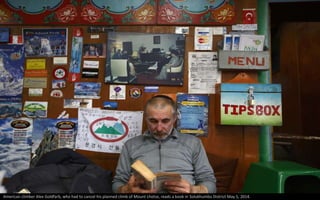 American climber Alex Goldfarb, who had to cancel his planned climb of Mount Lhotse, reads a book in Solukhumbu District May 5, 2014.
 