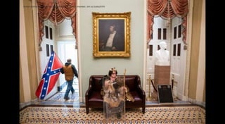 A man carries a confederate flag outside the Senate chamber. Jim Lo Scalzo/EPA
 