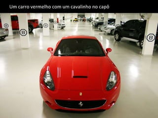 Um carro vermelho com um cavalinho no capô 
 