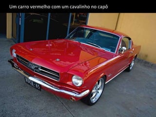 Um carro vermelho com um cavalinho no capô 
 