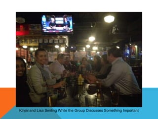 Kinjal and Lisa Smiling While the Group Discusses Something Important

 