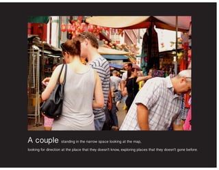 A couple standing in the narrow space looking at the map,
looking for direction at the place that they doesn’t know, exploring places that they doesn’t gone before.
 