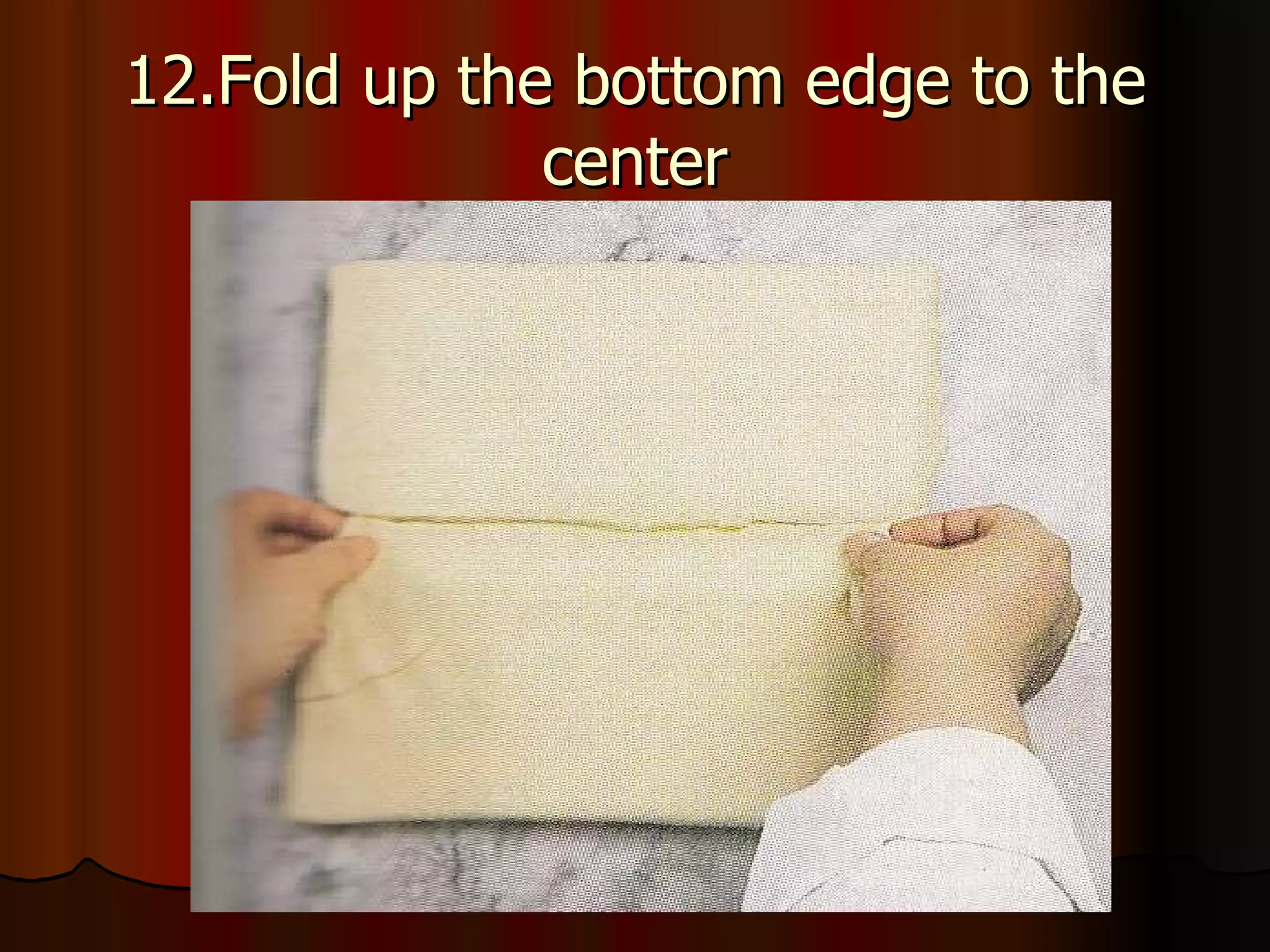 12.Fold up the bottom edge to the center 