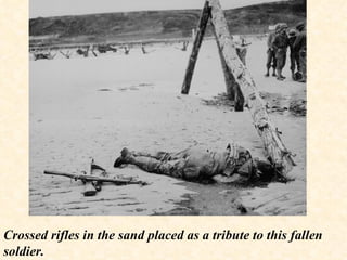 Crossed rifles in the sand placed as a tribute to this fallen soldier. 