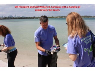 SPI President and CEO William R. Carteaux with a handful of
debris from the beach.
 