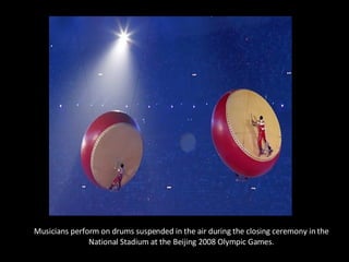 Musicians perform on drums suspended in the air during the closing ceremony in the National Stadium at the Beijing 2008 Olympic Games. 
