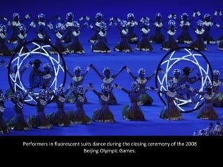 Performers in fluorescent suits dance during the closing ceremony of the 2008 Beijing Olympic Games. 