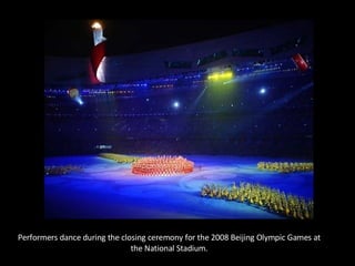 Performers dance during the closing ceremony for the 2008 Beijing Olympic Games at the National Stadium. 