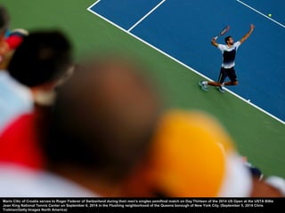 Rain falls during a suspension of play on Day Seven of the 2014 US Open at the USTA Billie Jean King National Tennis Cente...
