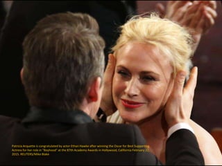 Patricia Arquette is congratulated by actor Ethan Hawke after winning the Oscar for Best Supporting
Actress for her role i...