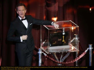 Host Neil Patrick Harris stands next to a sealed briefcase holding his predictions of the Oscar winners during the 87th Ac...