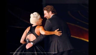 Lady Gaga and Bradley Cooper laugh after performing "Shallow" from "A Star Is Born." REUTERS/Mike Blake
 
