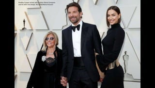 Bradley Cooper arrives with mother Gloria Campano
and his wife Irina Shayk. REUTERS/Mario Anzuoni
 