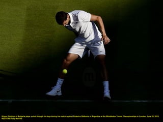 Grigor Dimitrov of Bulgaria plays a shot through his legs during his match against Federico Delbonis of Argentina at the Wimbledon Tennis Championships in London, June 29, 2015.
REUTERS/Toby Melville
 