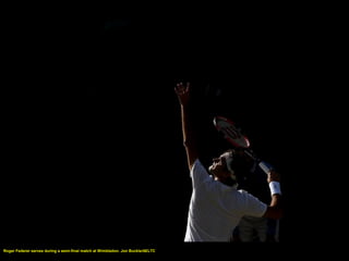 Roger Federer serves during a semi-final match at Wimbledon. Jon Buckle/AELTC
 