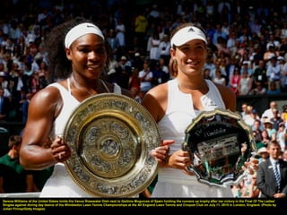 Serena Williams of the United States holds the Venus Rosewater Dish next to Garbine Muguruza of Spain holding the runners up trophy after her victory in the Final Of The Ladies'
Singles against during day twelve of the Wimbledon Lawn Tennis Championships at the All England Lawn Tennis and Croquet Club on July 11, 2015 in London, England. (Photo by
Julian Finney/Getty Images)
 