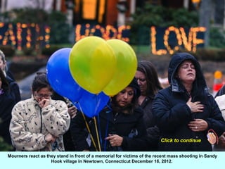 Click to continue


Mourners react as they stand in front of a memorial for victims of the recent mass shooting in Sandy
 ...