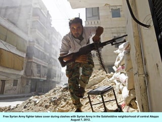 Free Syrian Army fighter takes cover during clashes with Syrian Army in the Salaheddine neighborhood of central Aleppo
   ...