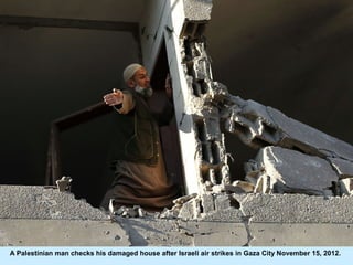 A Palestinian man checks his damaged house after Israeli air strikes in Gaza City November 15, 2012.
 