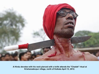 A Hindu devotee with his neck pierced with a knife attends the "Chadak" ritual at
           Krishanadevpur village, north...
