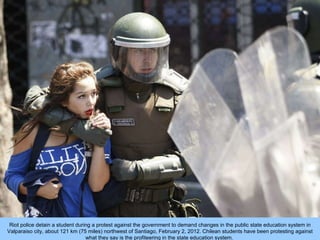 Riot police detain a student during a protest against the government to demand changes in the public state education syste...