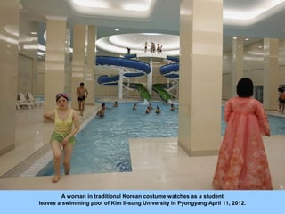 A woman in traditional Korean costume watches as a student
leaves a swimming pool of Kim Il-sung University in Pyongyang A...