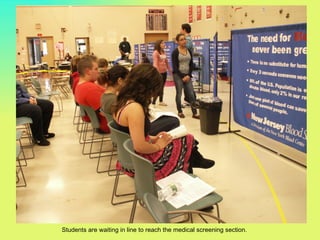 Students are waiting in line to reach the medical screening section.
 