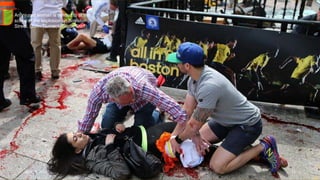 An injured woman is tended to at the
scene of the explosion on Boylston
Street. (John Tlumacki/Globe Staff)#
April 24, 2013 11
 