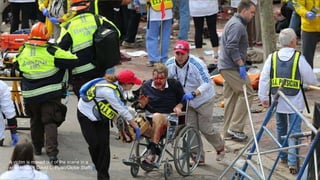 A victim is moved out of the scene in a
wheelchair. ( David L. Ryan/Globe Staff) #
April 24, 2013 15
 