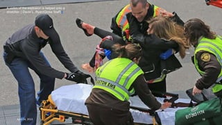 A victim of the explosion is helped onto a
stretcher. ( David L. Ryan/Globe Staff)#
April 24, 2013 18
 