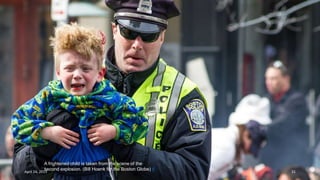 A frightened child is taken from the scene of the
second explosion. (Bill Hoenk for the Boston Globe) #
April 24, 2013 31
 