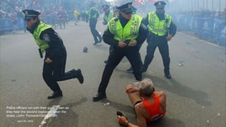Police officers run with their guns drawn as
they hear the second explosion down the
street. (John Tlumacki/Globe Staff)#
April 24, 2013 6
 