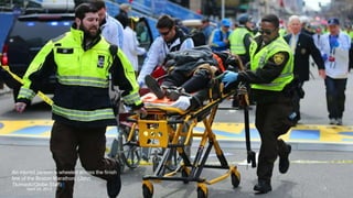 An injured person is wheeled across the finish
line of the Boston Marathon. (John
Tlumacki/Globe Staff)#
April 24, 2013 7
 