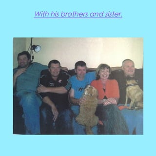 With his brothers and sister.

 