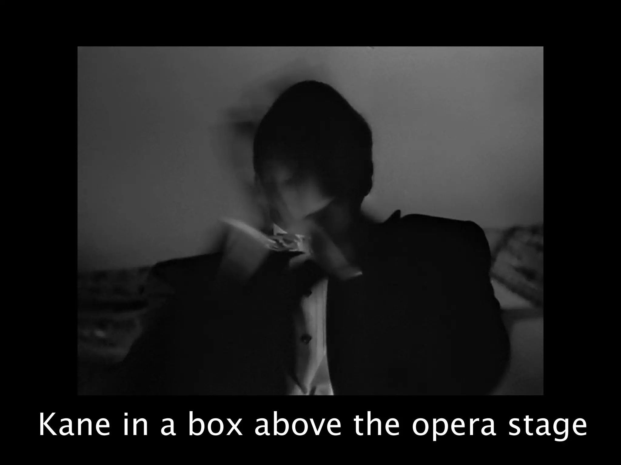 Kane in a box above the opera stage
