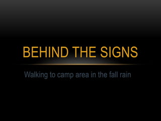 BEHIND THE SIGNS
Walking to camp area in the fall rain
 