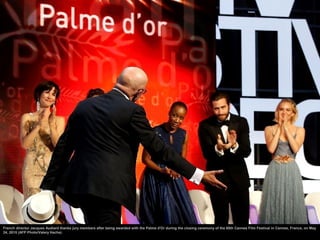 French director Jacques Audiard thanks jury members after being awarded with the Palme d'Or during the closing ceremony of...