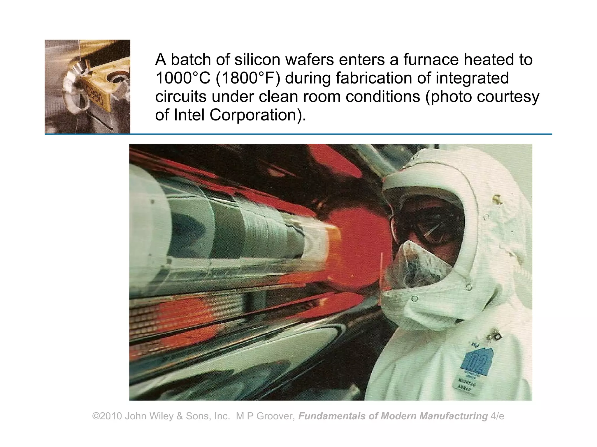 A batch of silicon wafers enters a furnace heated to 1000 °C (1800°F) during fabrication of integrated circuits under clean room conditions (photo courtesy of Intel Corporation). 
