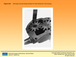 Figure 5-22   Gear-type oil pump being checked for tooth clearance in the housing.  