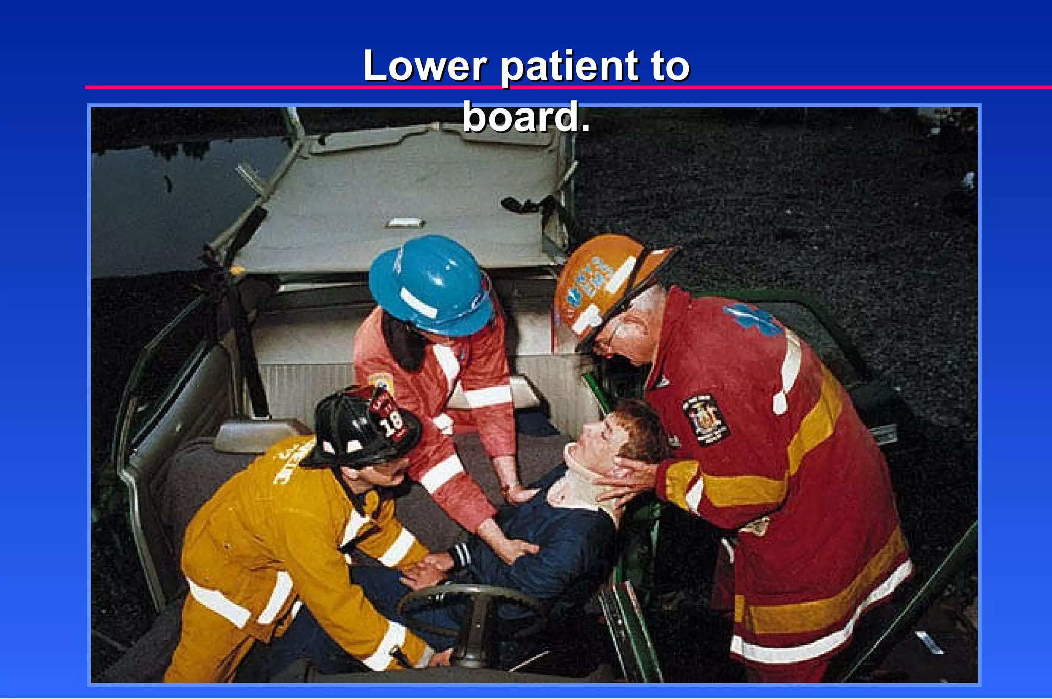 Lower patient to board. 