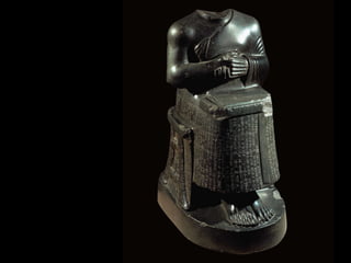 Figure 2-16  Seated statue of Gudea holding temple plan, from Girsu (modern Telloh), Iraq, ca. 2100 BCE. Diorite, 2’ 5” high. Louvre, Paris. 