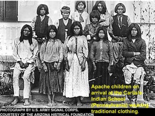 Apache children on arrival at the Carlisle Indian School (Pennsylvania) wearing traditional clothing . 