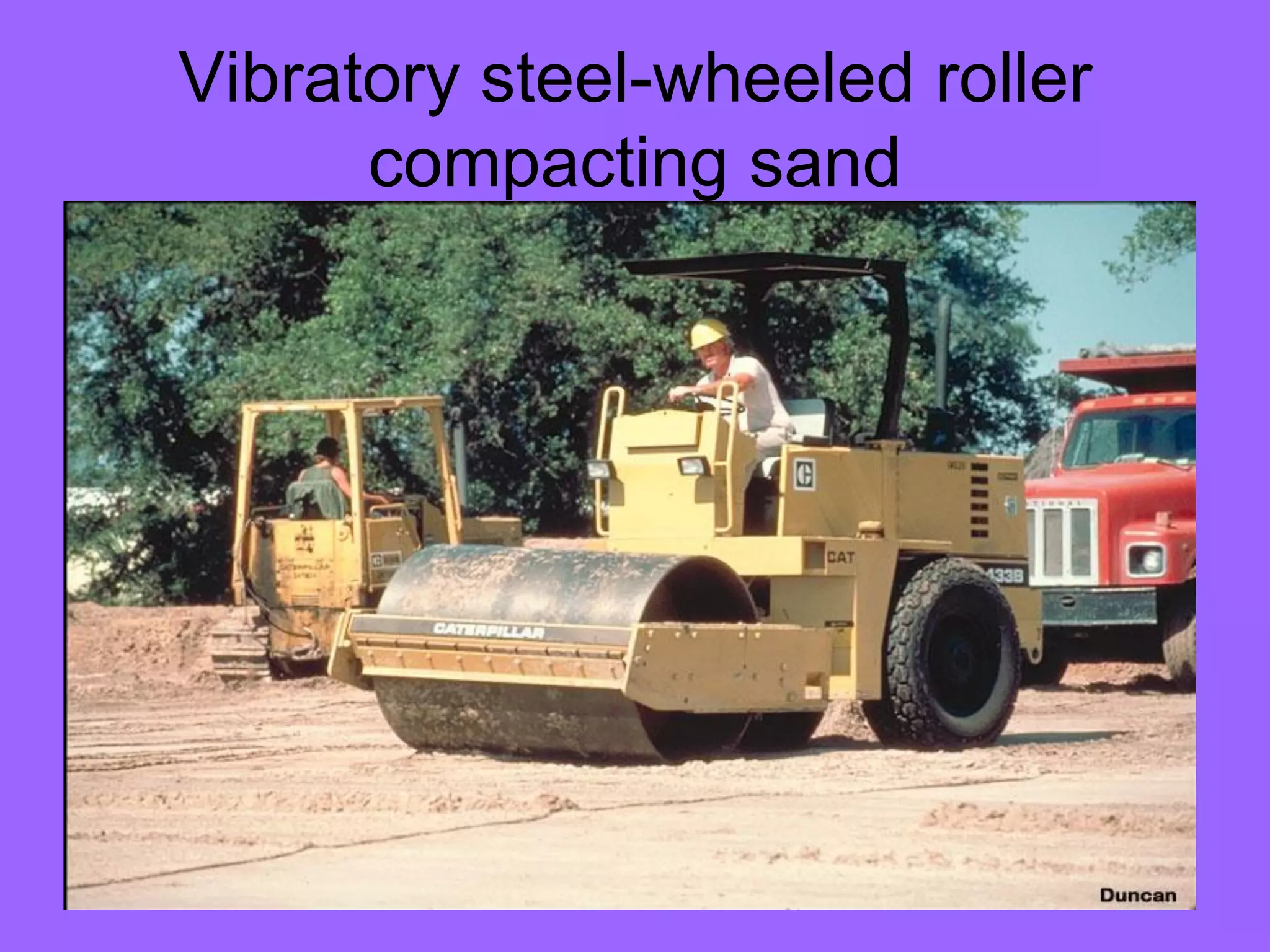 Vibratory steel-wheeled roller
compacting sand
 
