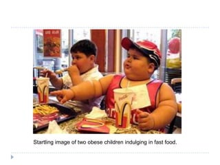 Startling image of two obese children indulging in fast food.
 