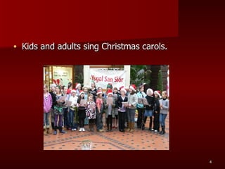 Kids and adults sing Christmas carols. 