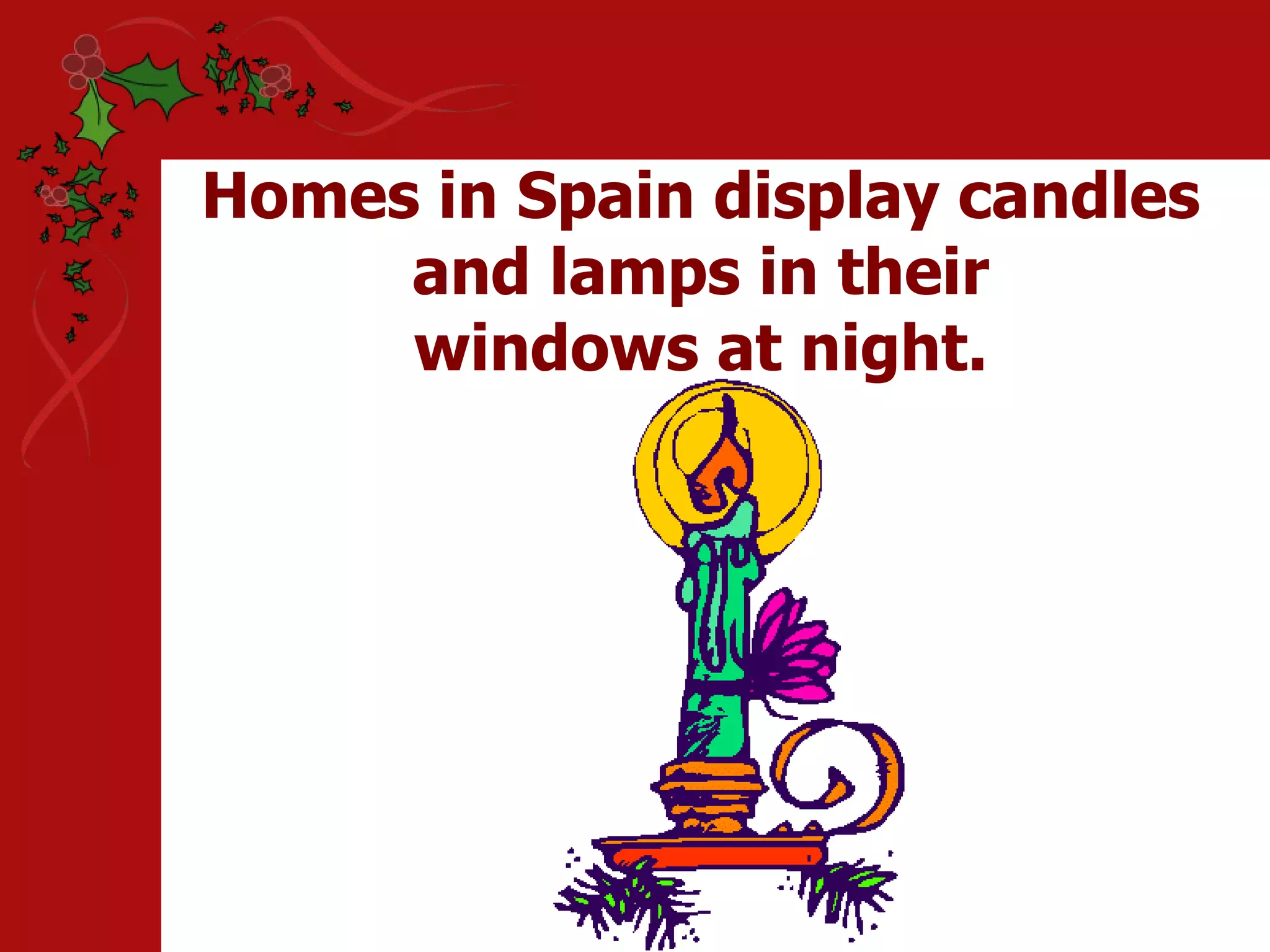 Homes in Spain display candles and lamps in their windows at night.