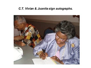 C.T. Vivian & Juanita sign autographs. 