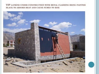 VIP LATRINE UNDER CONSTRUCTION WITH METAL CLADDING BEING PAINTED
BLACK TO ABSORB HEAT AND CAUSE FUMES TO RISE
 