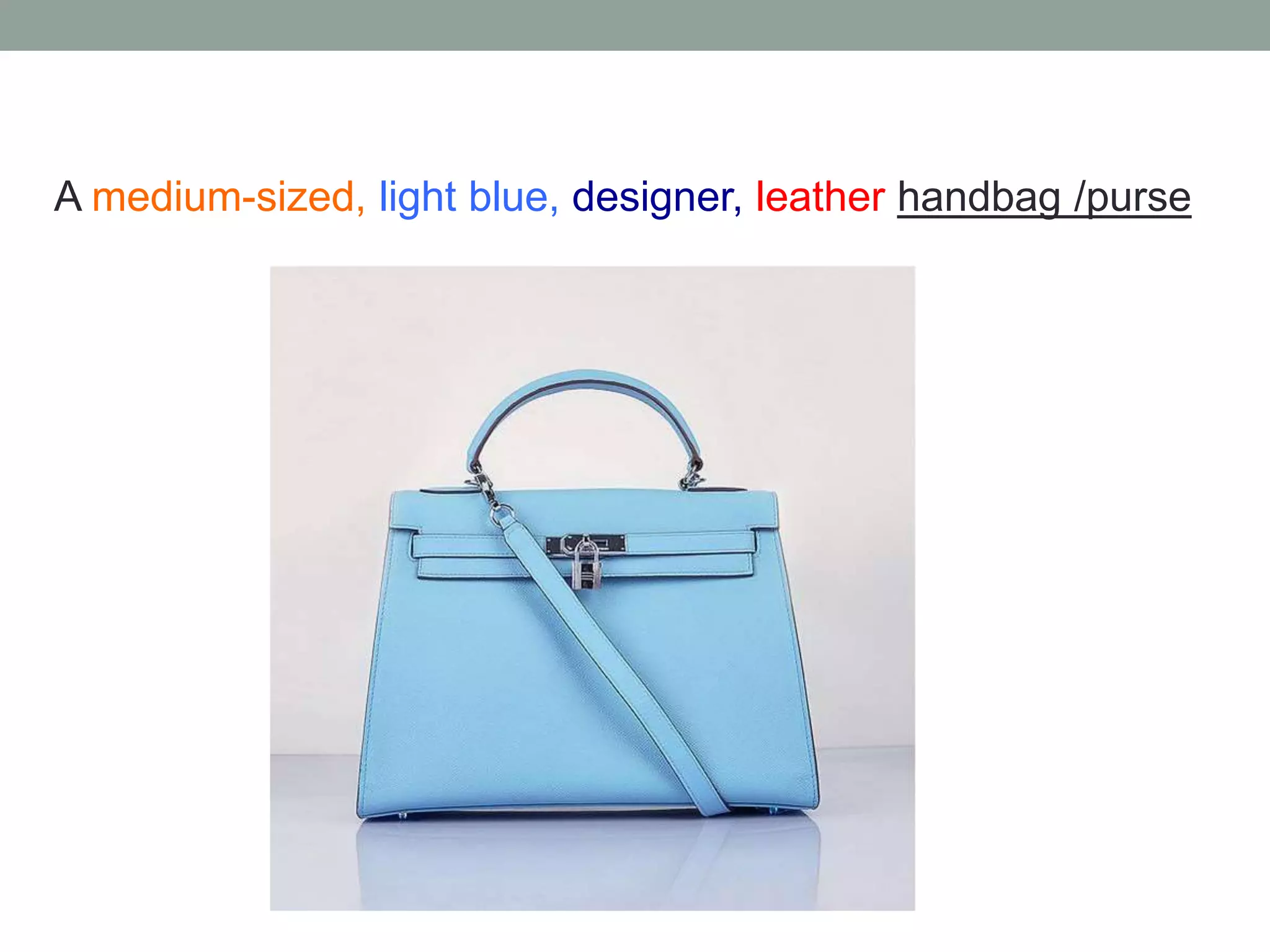 A medium-sized, light blue, designer, leather handbag /purse
