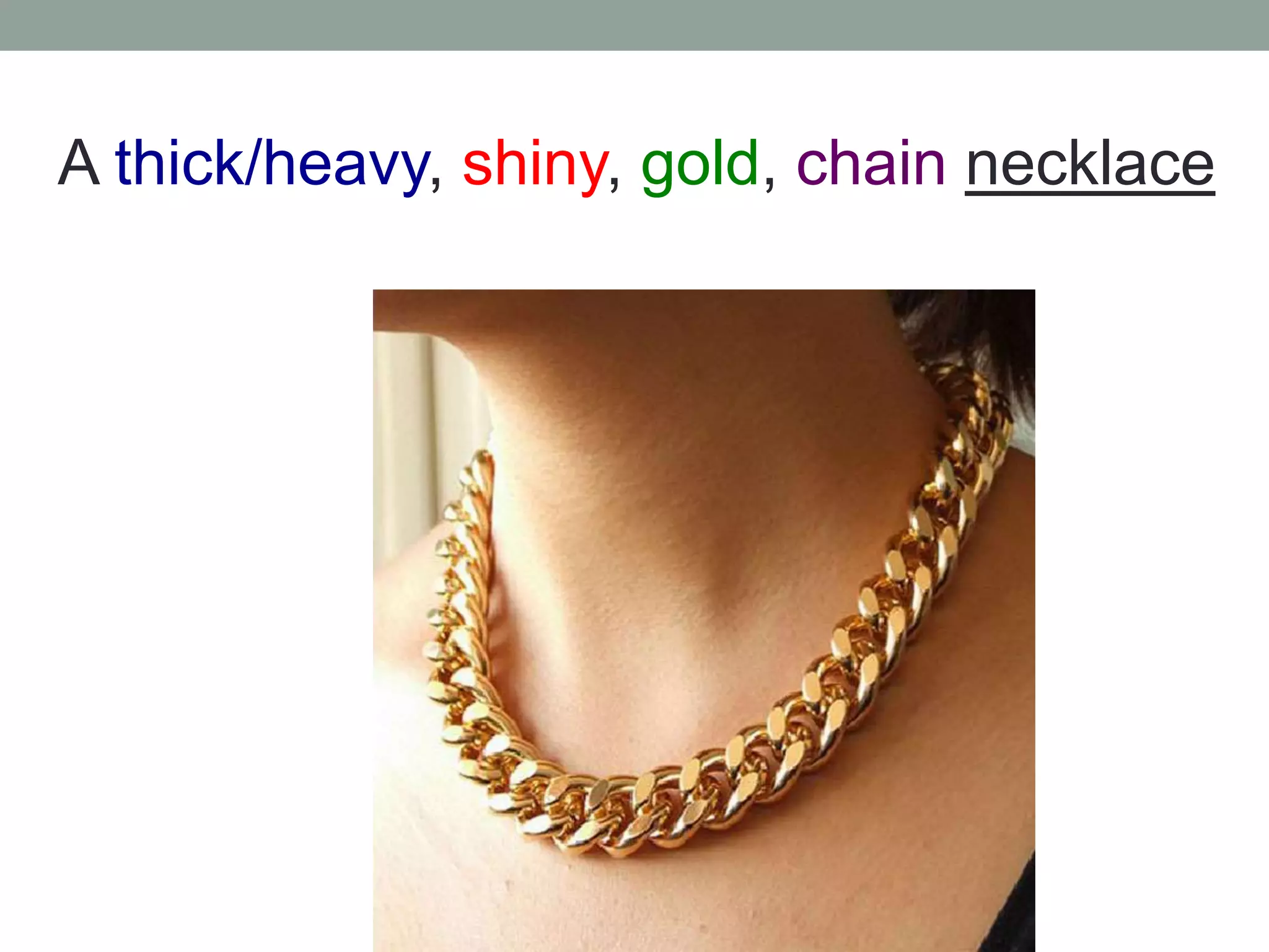 A thick/heavy, shiny, gold, chain necklace